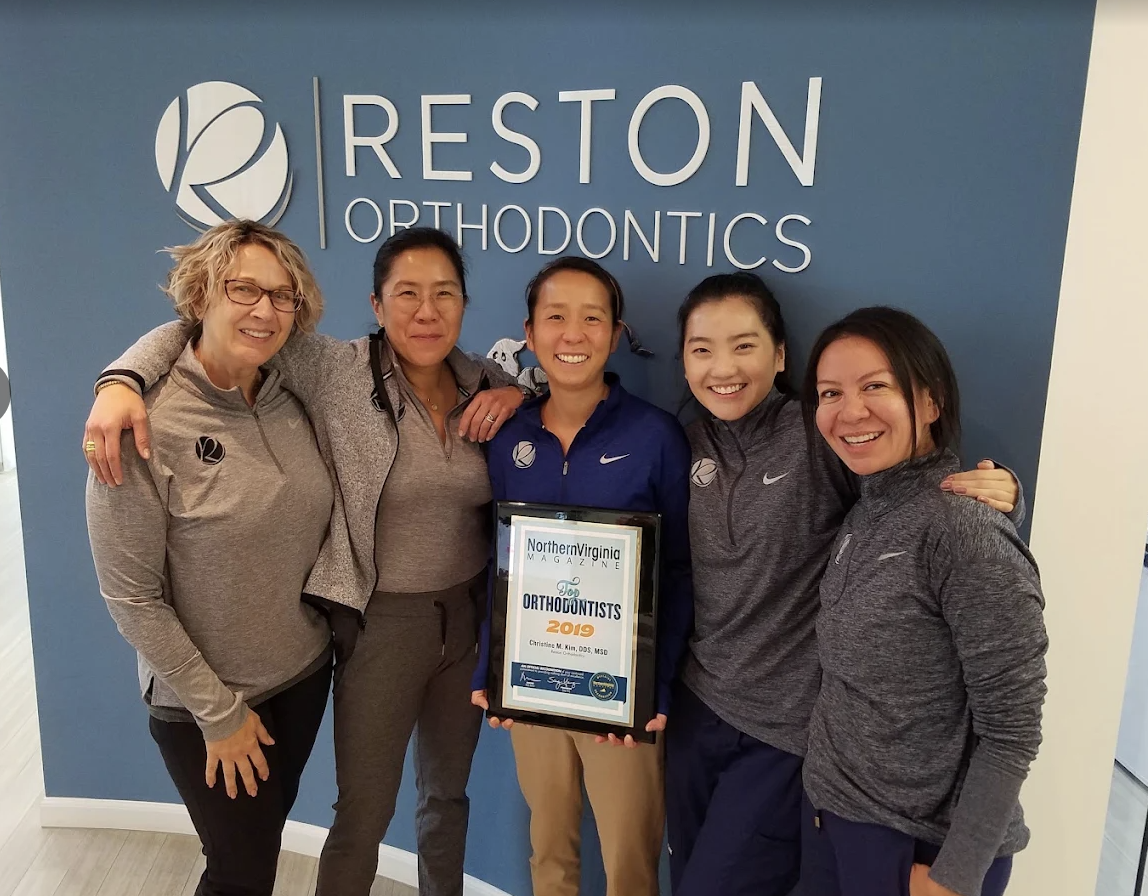 Dr. Christine Kim and the Reston Orthodontics team celebrating an orthodontic award
